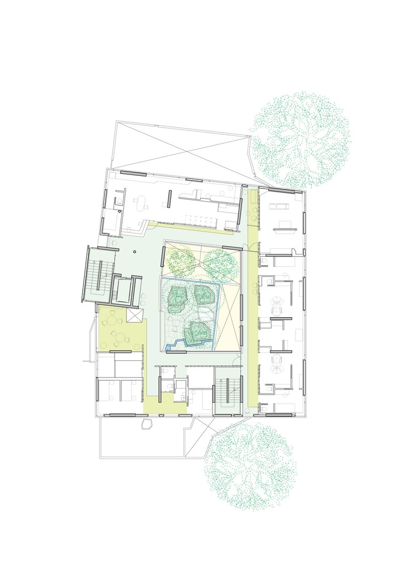 Floor plan drawing showing rooms arranged around a central courtyard with trees and paved paths