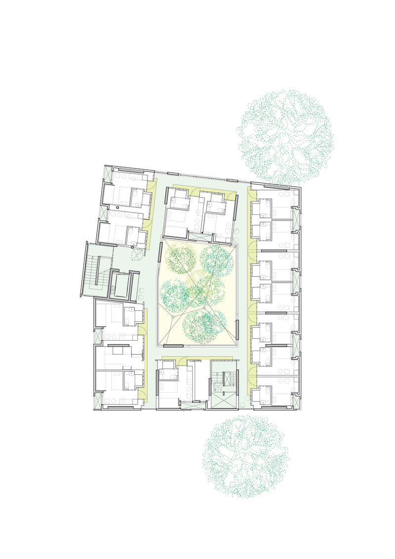 Floor plan drawing showing residential units flanking a central courtyard with clustered trees