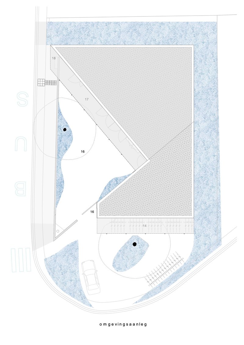 Site plan drawing showing a diagonal rectangular building with circular landscape elements and surrounding paved areas