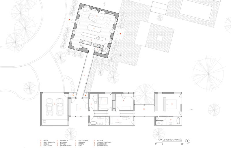 Ground floor plan drawing depicting garage, living spaces, and a square volume with surrounding paved terrace