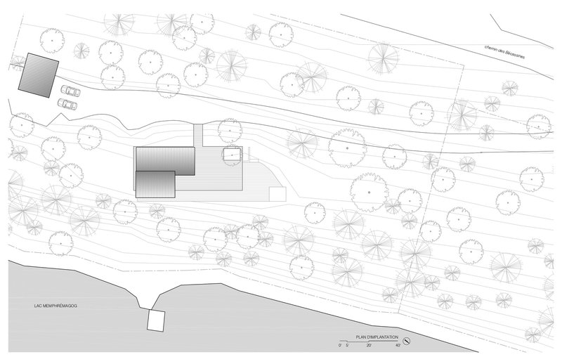 Site plan drawing showing the building placement among tree canopies and sloping terrain lines