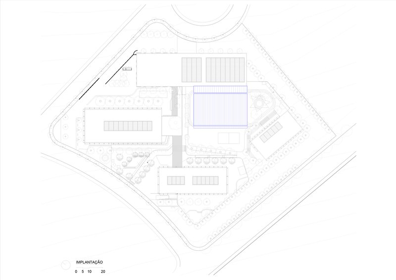 Site plan drawing showing campus layout with rectangular buildings and central sports field