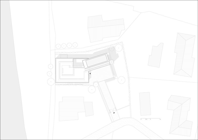 Site plan drawing showing an angular building footprint with courtyard and adjacent structures