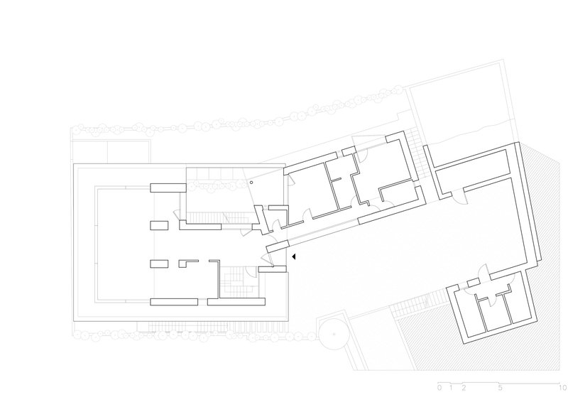 Upper floor plan drawing revealing angular volumes with subdivided rooms and outdoor terrace spaces