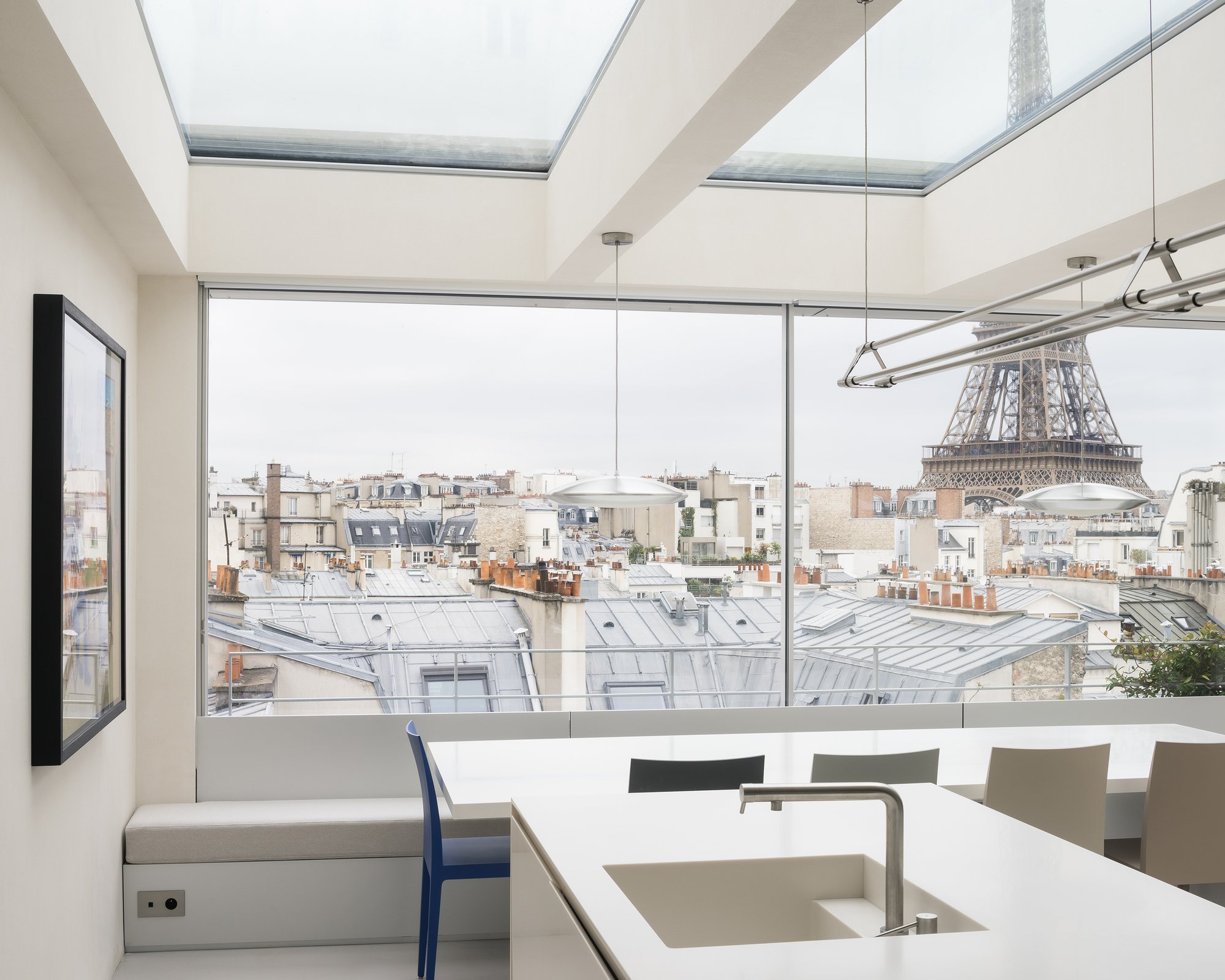 heros Strips a 1970s Paris Duplex Down to Raw Concrete and Rebuilds It as a Rooftop Sanctuary