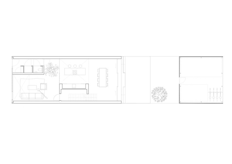Floor plan drawing showing living and dining areas with kitchen and outdoor courtyard with tree