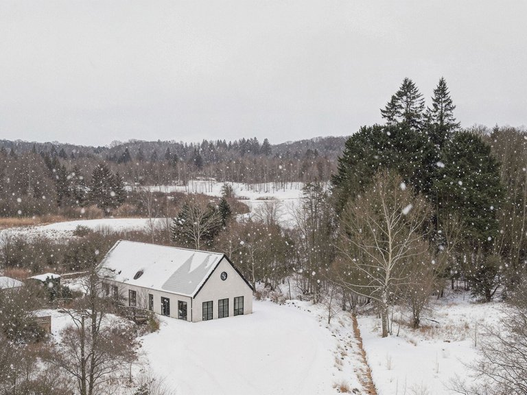 NORM Architects Distill a Danish Lakeside Home to Its Barn Essentials