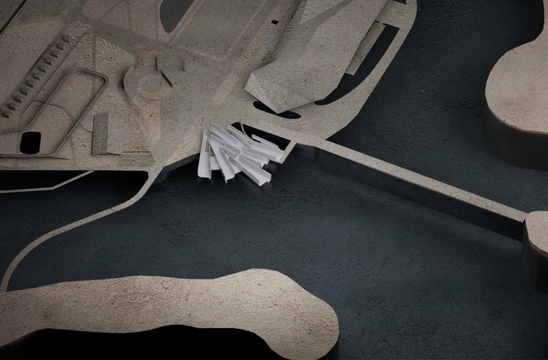 Aerial view of a physical model with angular white roof forms nestled between sculptural earthwork berms