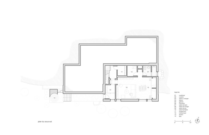 Ground floor plan drawing showing an L-shaped layout with living spaces and service areas