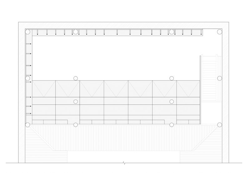 Section drawing showing structural column grid with diagonal bracing and a stepped landscape element below