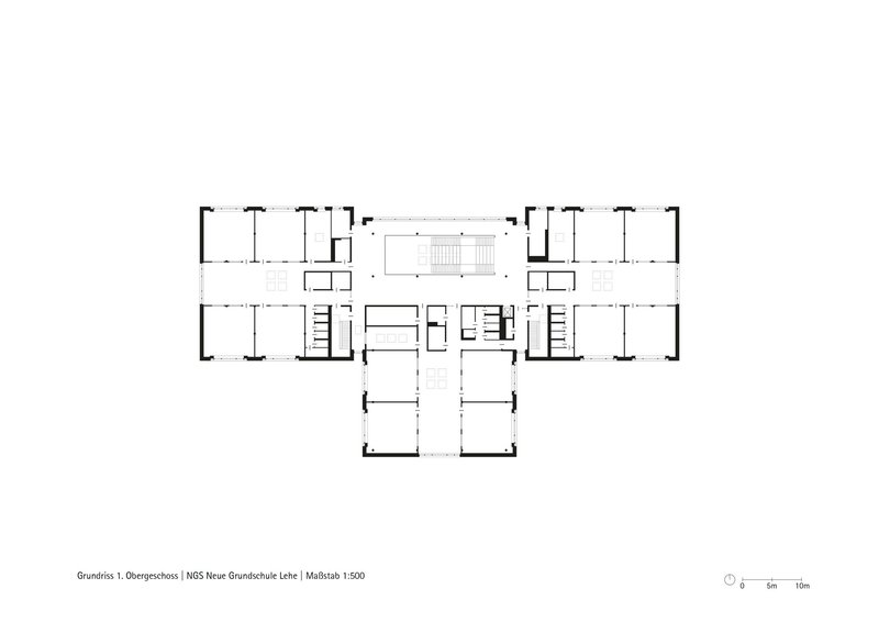 Upper floor plan drawing showing a symmetrical wing layout with central stair and service cores