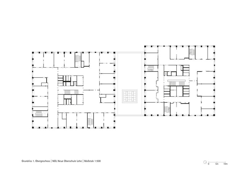 Floor plan drawing showing two rectangular buildings with perimeter columns and internal room divisions