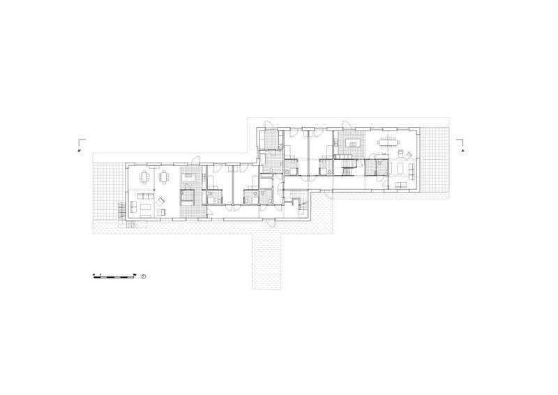 Ground floor plan showing residential units with terraces and central circulation core