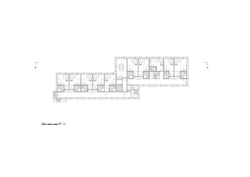 Upper floor plan showing individual dwelling units arranged along a linear corridor