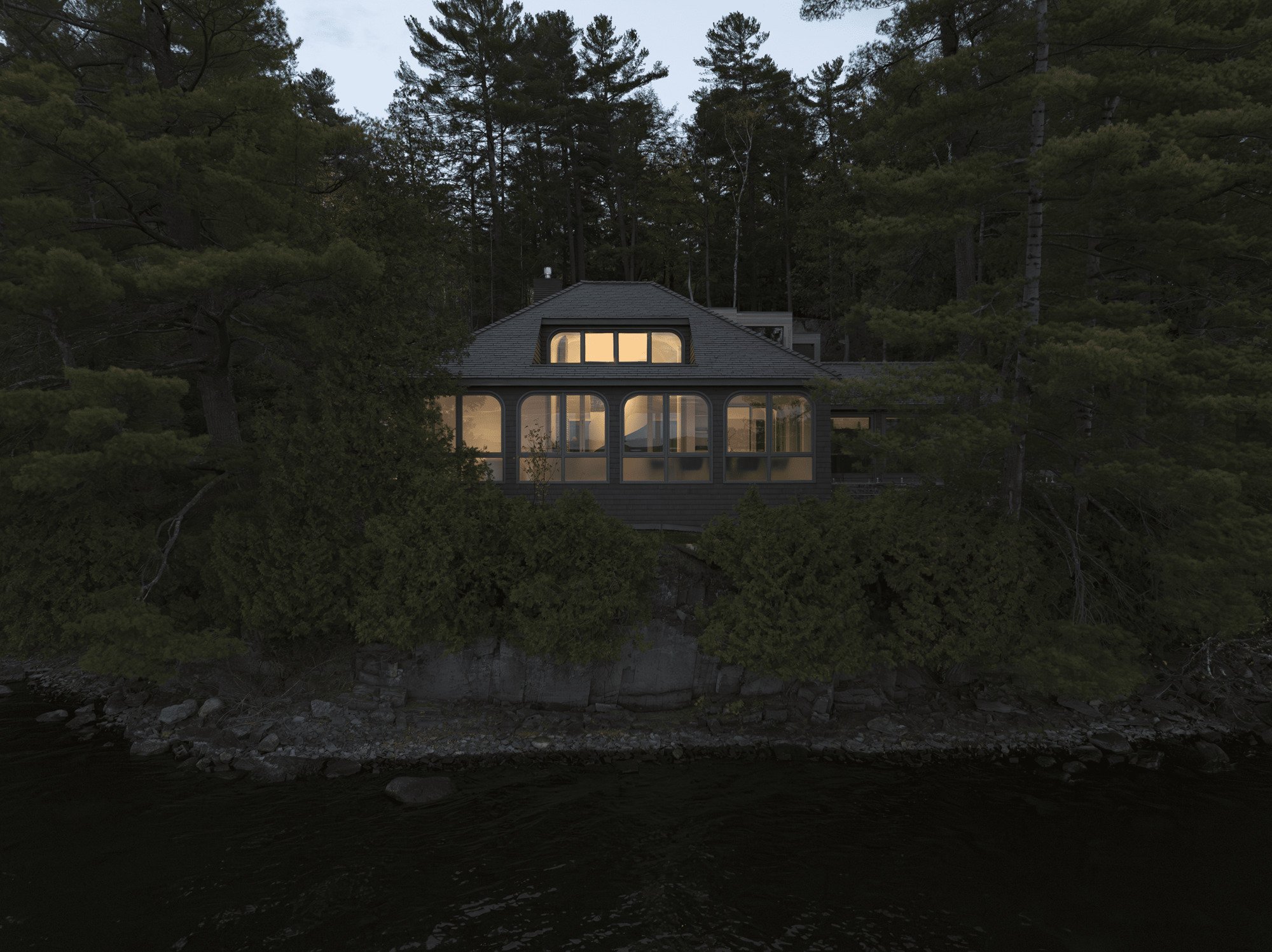 YH2 Architecture Stretches a Lake Cottage into Two Cedar Pavilions Linked by a Glass Walkway