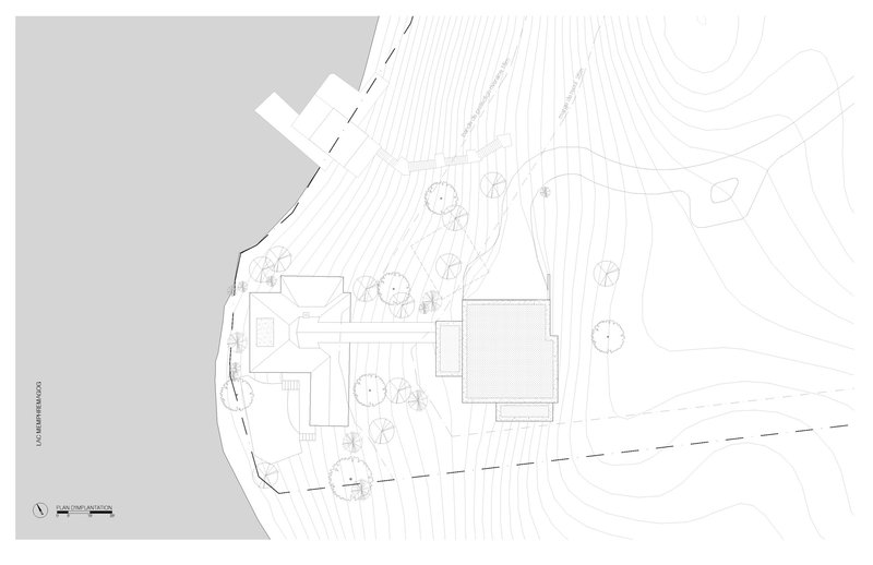 Site plan drawing showing the main house with deck or terrace area surrounded by planted vegetation