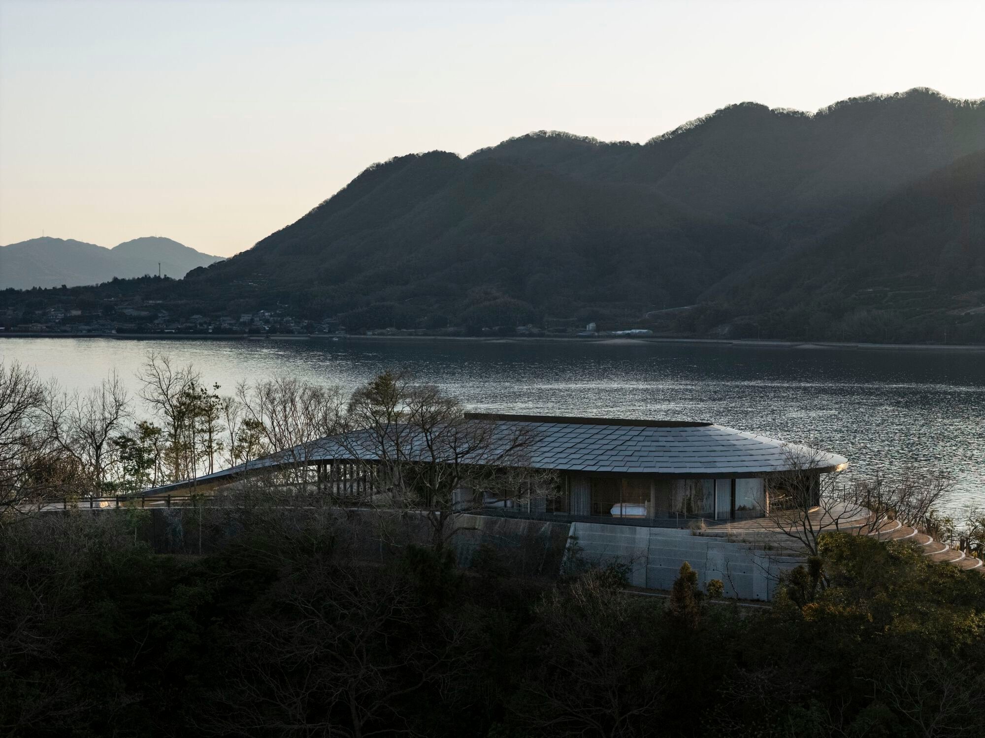 BIG Carves Three Rammed Earth Villas into a Japanese Island Hillside for Not a Hotel