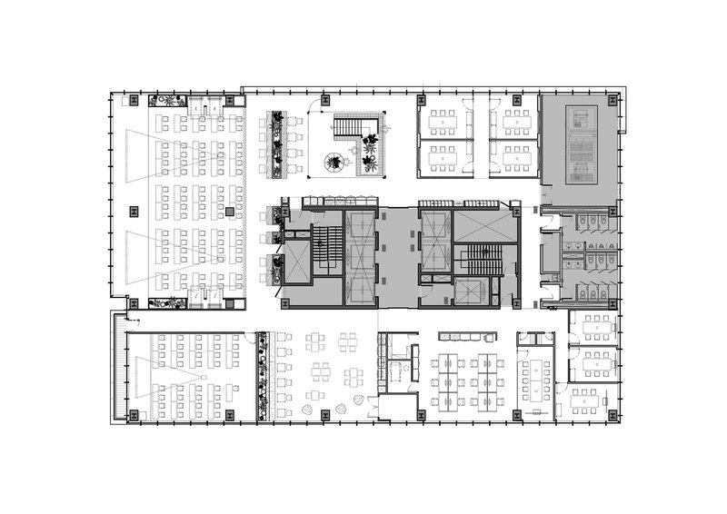 Floor plan drawing showing open-plan workspaces with central core and perimeter circulation