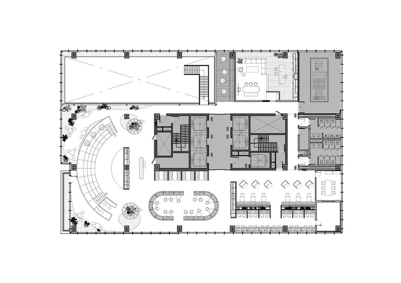 Floor plan drawing showing curved seating area and open collaboration spaces with scattered furniture