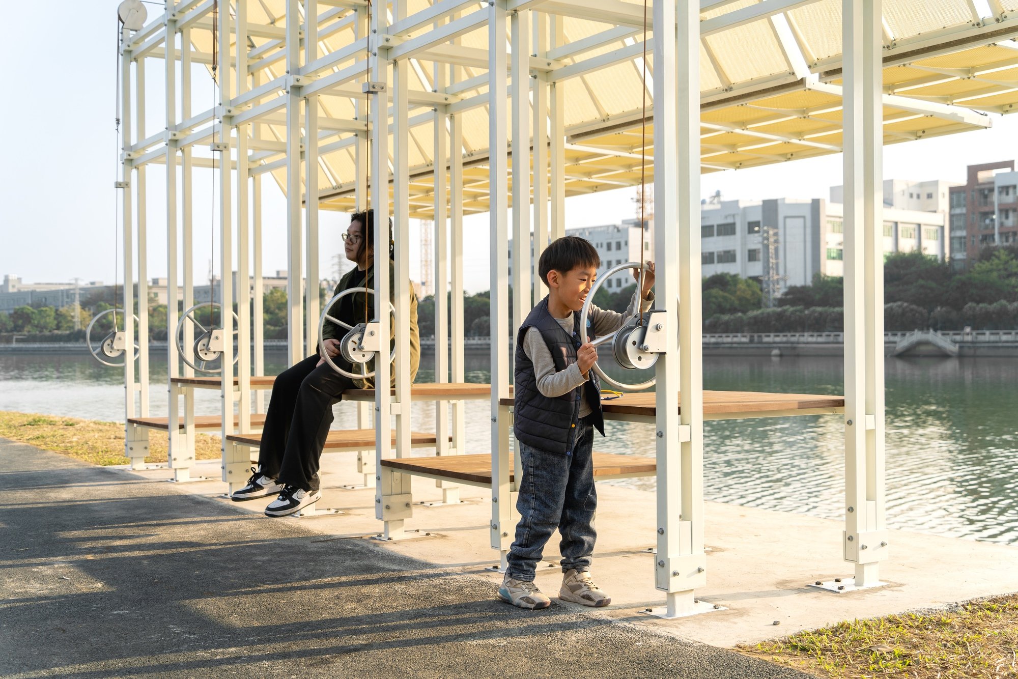 A.N.D Installs a Hand-Cranked Shading System Along a Foshan Riverbank