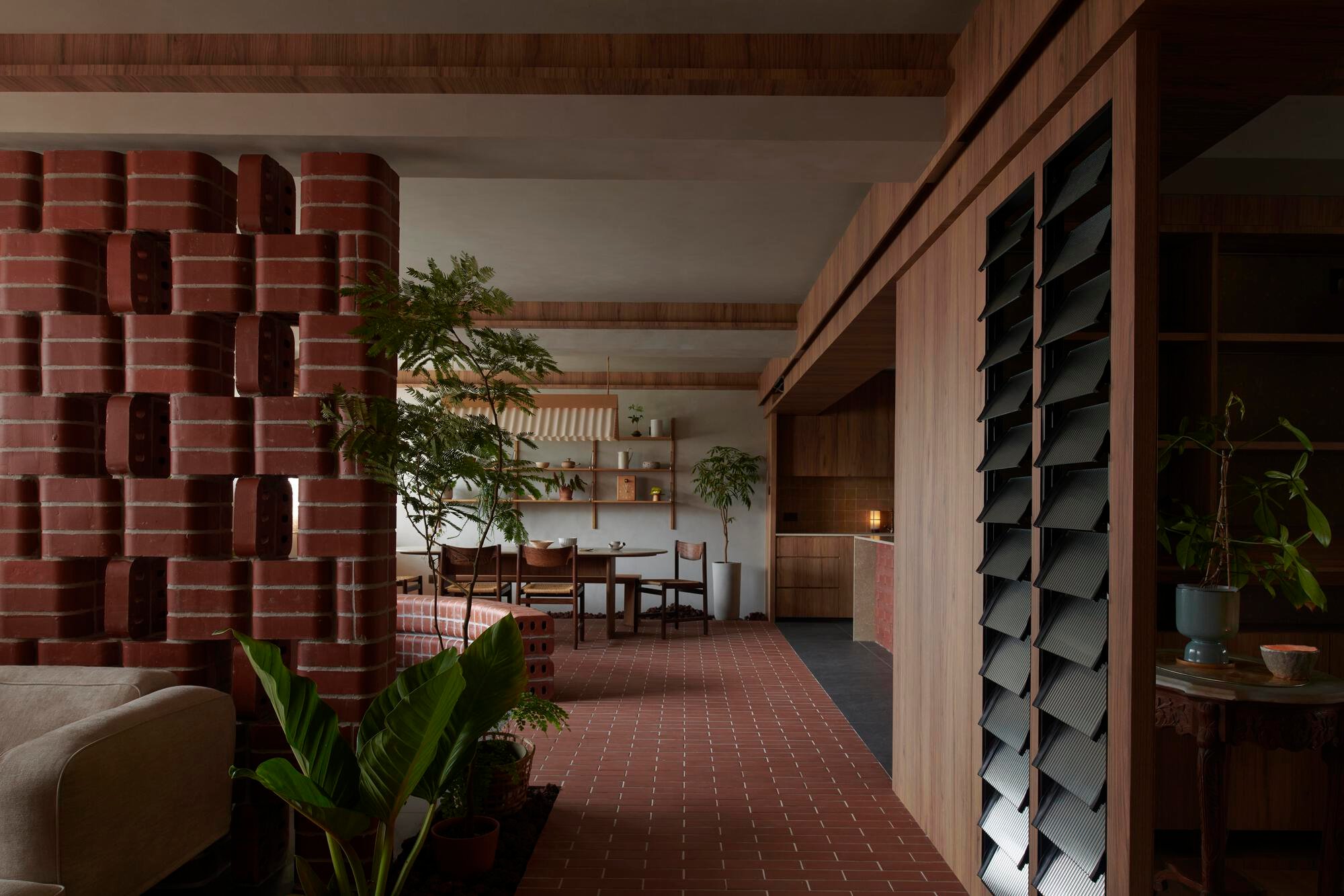 A Horticulturist's Home Wrapped in Brick and Green