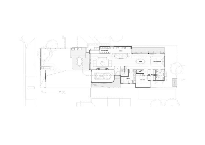 Ground floor plan drawing showing open living spaces with a central staircase and kitchen along the side