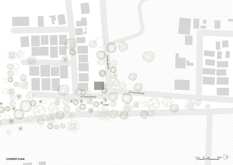 Context plan drawing showing the building footprint among surrounding structures, roads, and tree canopies