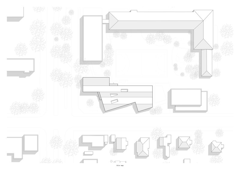 Roof plan drawing depicting L-shaped volumes arranged around a central courtyard with scattered tree symbols