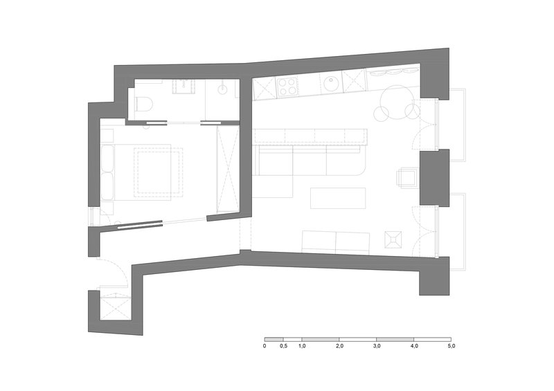 Floor plan drawing showing an angular apartment with bedroom, living area, and kitchen