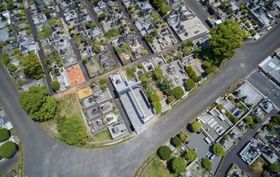This aerial photograph showcases a meticulously organized cemetery, characterized by rows of tombsto