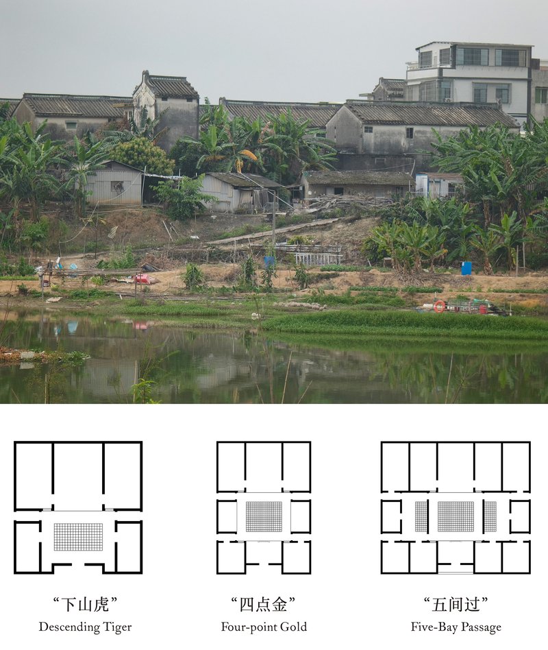 View across a pond toward clustered village houses and a newer multistory building under overcast skies
