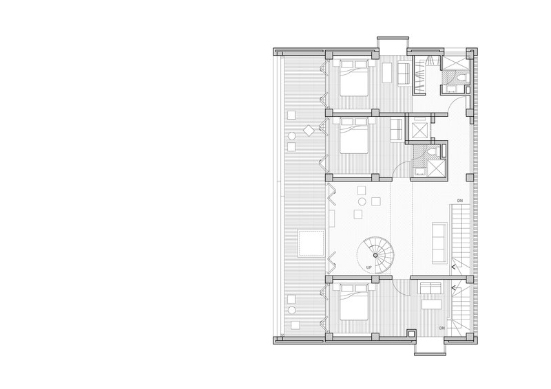 Floor plan showing bedroom arrangement around a central spiral staircase with exterior terrace access