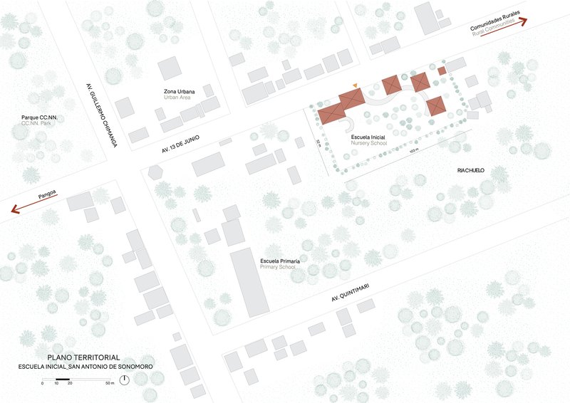 Site plan drawing showing red building clusters among trees along two intersecting avenues