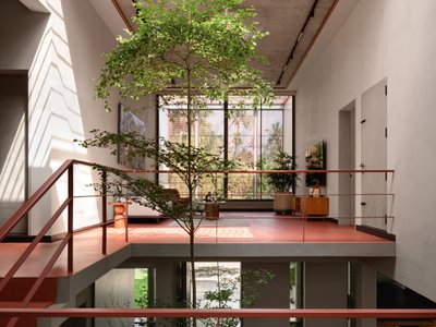 i2a Architects Studio Builds a Bold Red Dream House Around Trees in Kerala