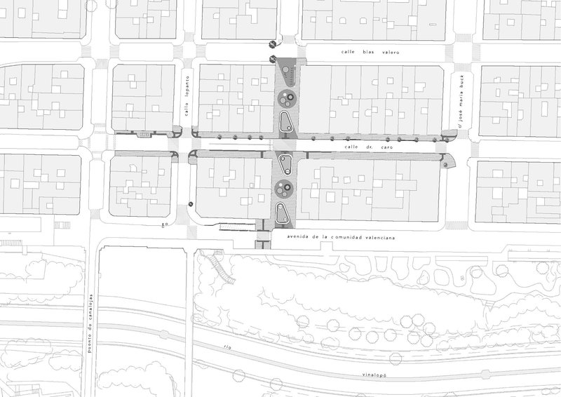 Site plan drawing showing street intersection with circular planting elements and building footprints