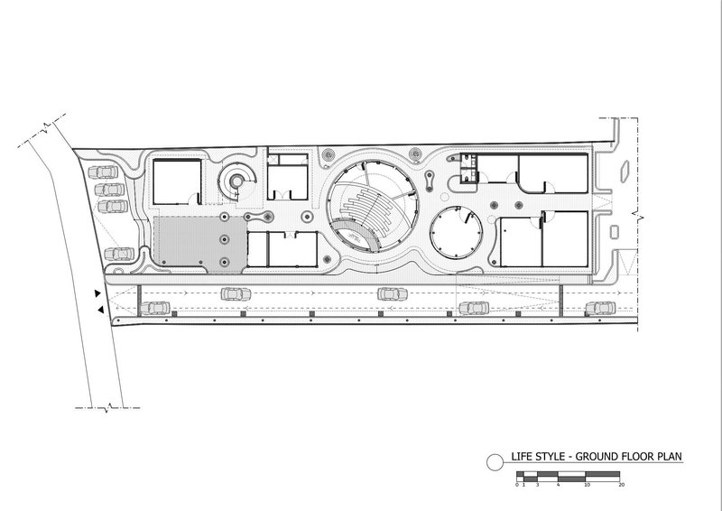 Ground floor plan drawing showing circular central space and adjacent parking