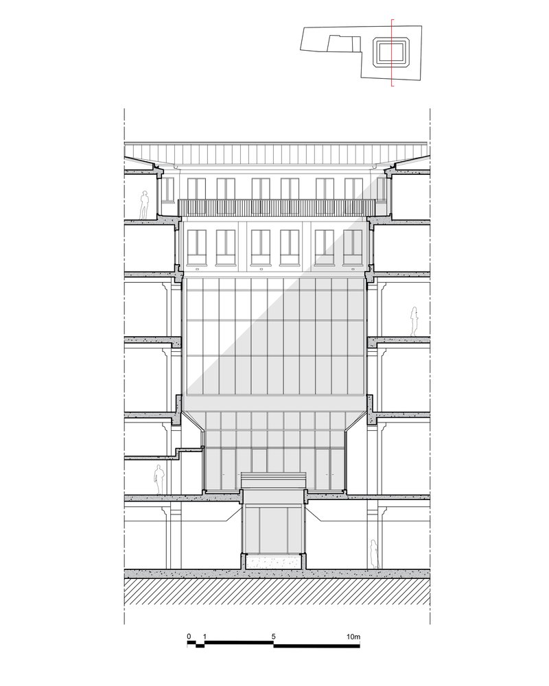 Section drawing showing a central atrium with flanking floor slabs and rooftop structure