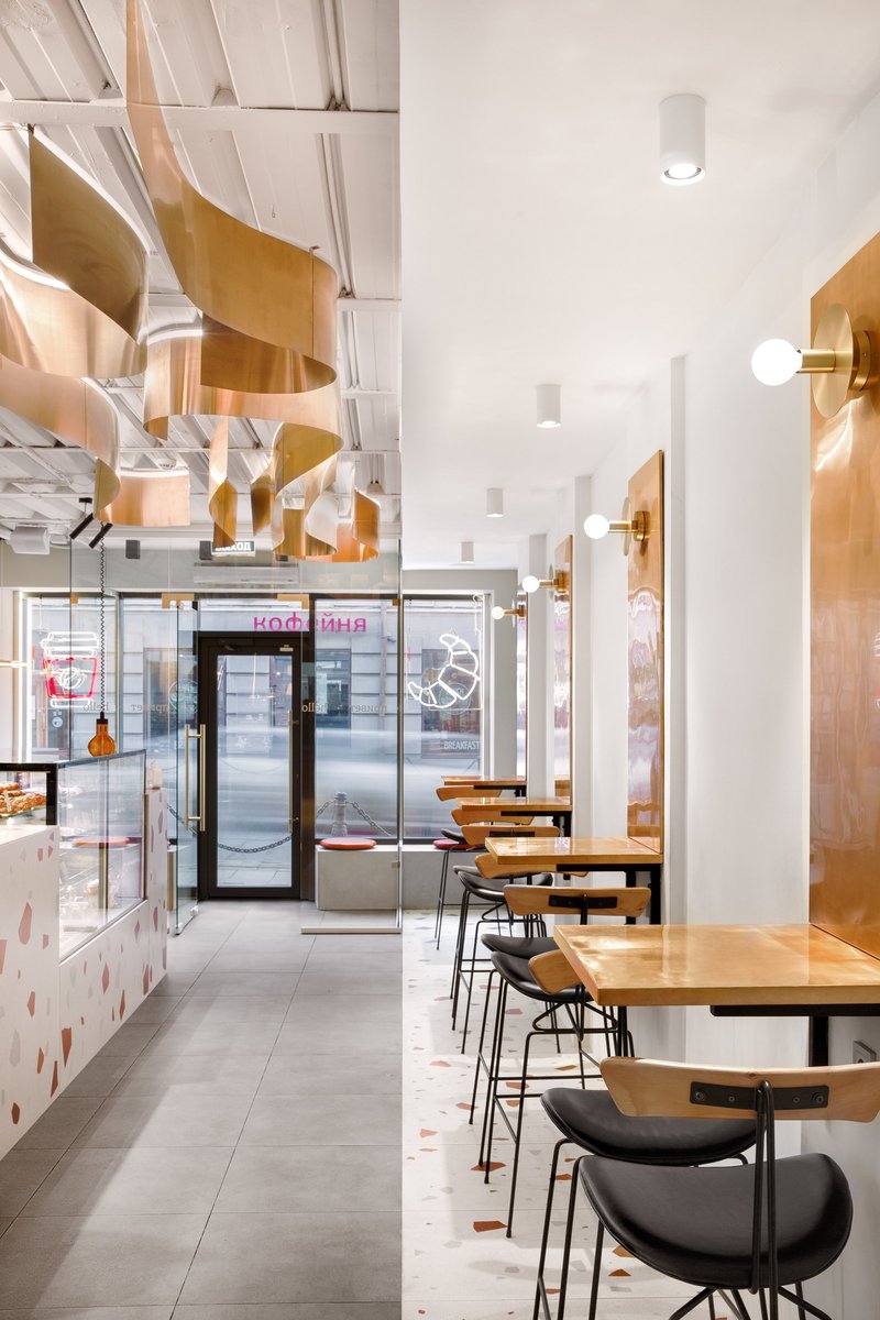 Minimal seating edge activating the narrow frontage