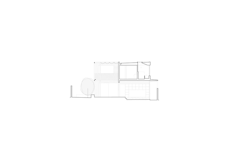 Section drawing revealing interior volumes with a curved wall and varied ceiling heights