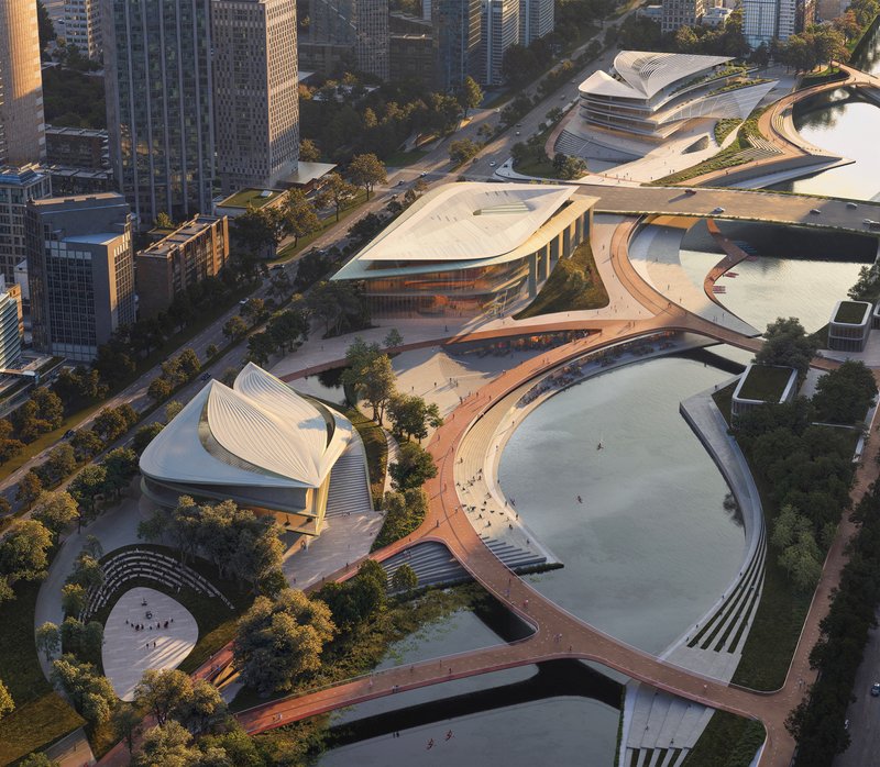 Cluster of curved white roof volumes linked by elevated timber pathways in golden hour light