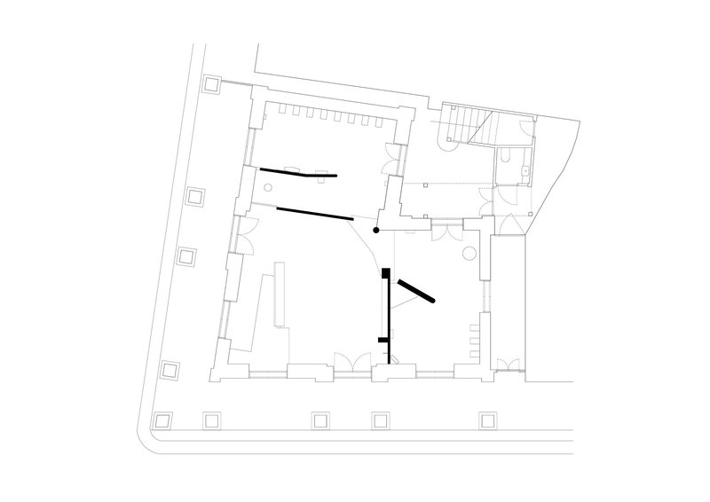 Floor plan drawing of an irregular building with central rooms and adjacent stairwell