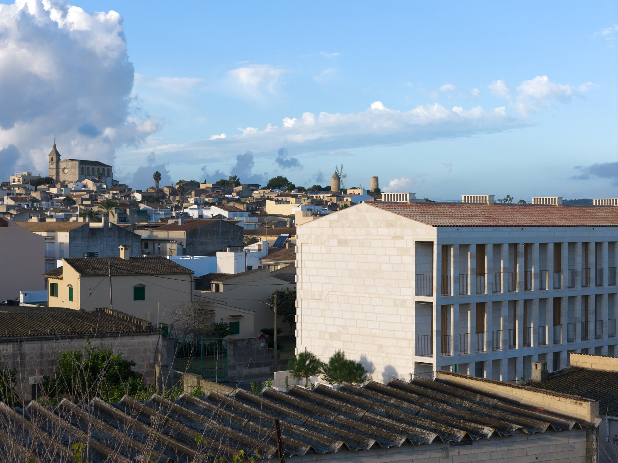Four Studios Revive Mallorcan Sandstone and Timber to Build Social Housing in Santa Margalida