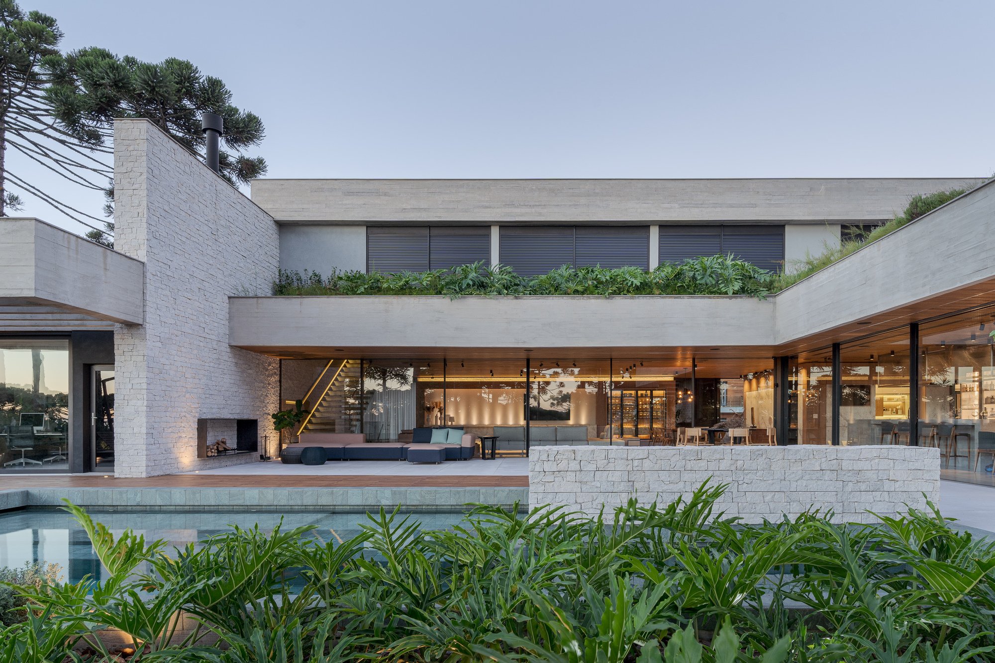 Studiocolnaghi Wraps a U-Shaped Concrete Home Around a Pool Terrace in Southern Brazil