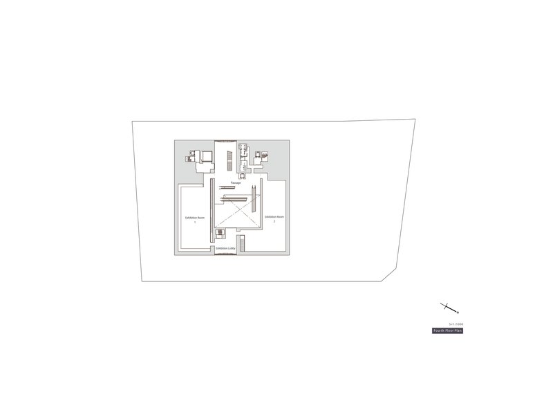 Basement floor plan drawing illustrating two large exhibition rooms flanking central service core