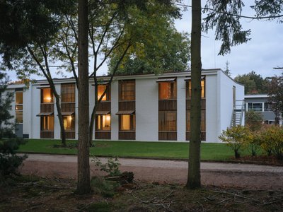 Namelok Restores a Century-Old Mennonite Retreat into a Timber-Lined Hotel Among the Dutch Pines