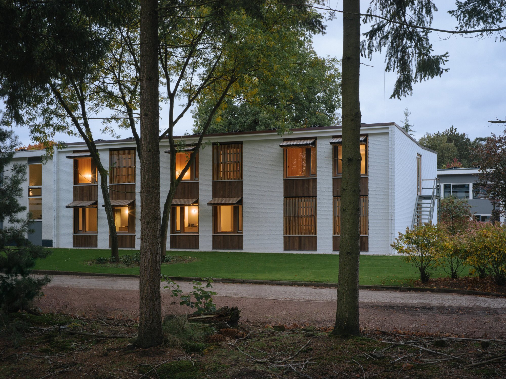 Namelok Restores a Century-Old Mennonite Retreat into a Timber-Lined Hotel Among the Dutch Pines