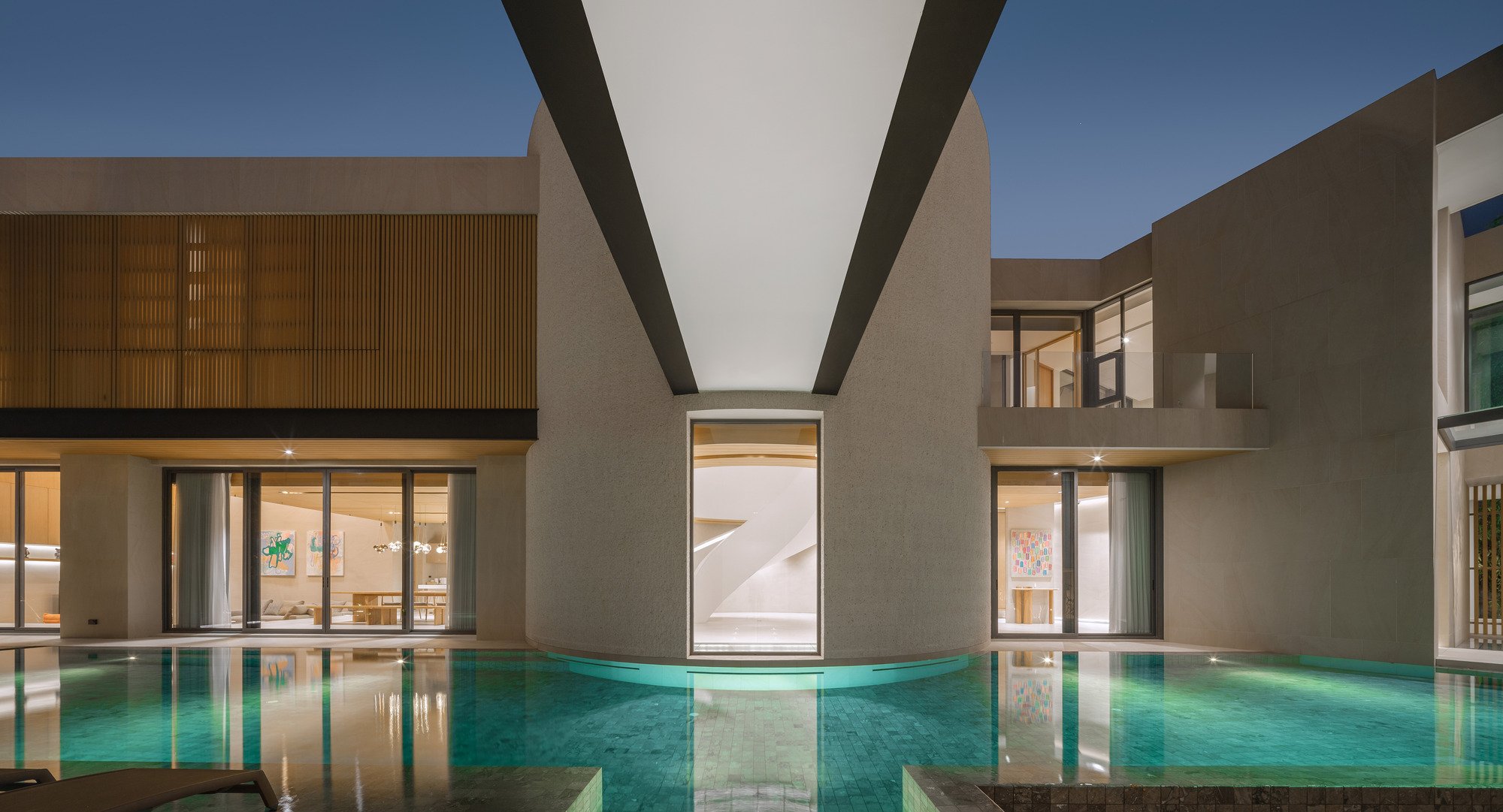 Elemental Living Wraps a Multigenerational Bangkok Home Around a Spiral Stair and Courtyard Pool