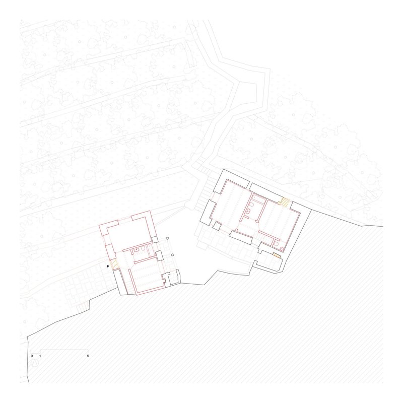 Floor plan drawing showing two adjacent structures with highlighted circulation path on sloped terrain