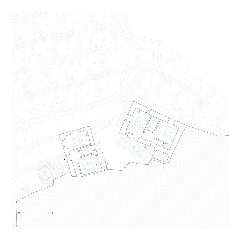 Floor plan drawing revealing interior room layouts and wall thicknesses of two connected structures