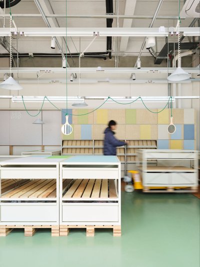This image showcases a modern and minimalist warehouse interior, emphasizing organization and functi